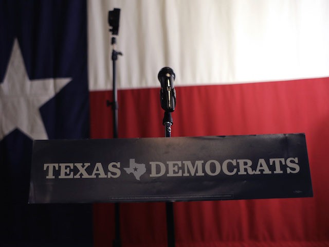A Texas Democrats sign hangs on a podium at a Democratic watch party following the Texas p
