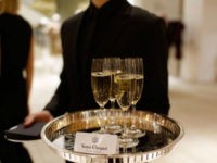 Veuve-Clicquot-served-getty NEW YORK, NY - JANUARY 30: Veuve Clicquot at the cocktail reception hosted by Saks Fifth Avenue And Off The Field Players' Wives Association on January 30, 2014 in New York City. (Photo by Jemal Countess/Getty Images for Saks Fifth Avenue)