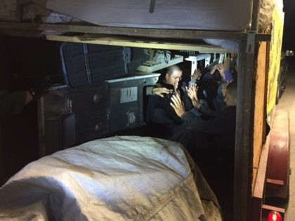 Border Patrol agents find 10 illegal aliens locked in trailer packed with cargo and appliances.