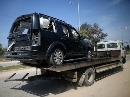A vehicle damaged in the explosion that went off near Palestinian Authority Prime Minister Rami Hamdallah's convoy is seen in the northern Gaza city of Beit Hanoun on March 13, 2018. (AFP Photo/Mohammed Abed)