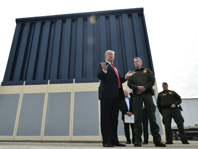 US President Donald Trump inspects border wall prototypes in San Diego, California on March 13, 2018. Donald Trump -- making his first trip to California as president -- warned there would be 'bedlam' without the controversial wall he wants to build on the border with Mexico, as he inspected several …