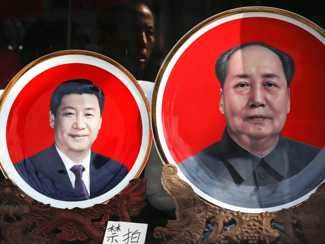 In this March 1, 2016 file photo, souvenir plates bearing images of Chinese President Xi Jinping, left, and late Chinese leader Mao Zedong are displayed at a shop near Tiananmen Square in Beijing. In 2016, the Chinese Communist Party bestows on Xi the wholly ceremonial yet highly significant title of …
