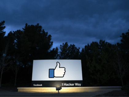 OPSHOT - A lit sign is seen at the entrance to Facebook's corporate headquarters location