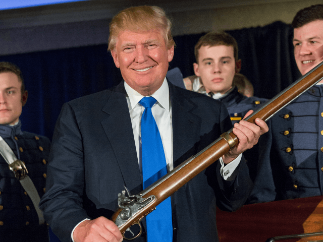 Reality TV host and New York real estate mogul Donald Trump holds up a replica flintlock rifle awarded him by cadets during the Republican Society Patriot Dinner at the Citadel Military College on February 22, 2015 in Charleston, South Carolina. Trump and U.S. Sen. Tim Scott (R-SC) were honored at …