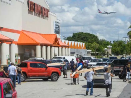 People leave with supplies outside a Home Depot store in Miami, Florida, as they prepare for Hurricane Irma, September 7, 2017. Miami orders people living in popular beach areas to evacuate as Hurricane Irma closes in, amid fuel shortages and traffic bottlenecks that threaten to complicate a mass exodus from …
