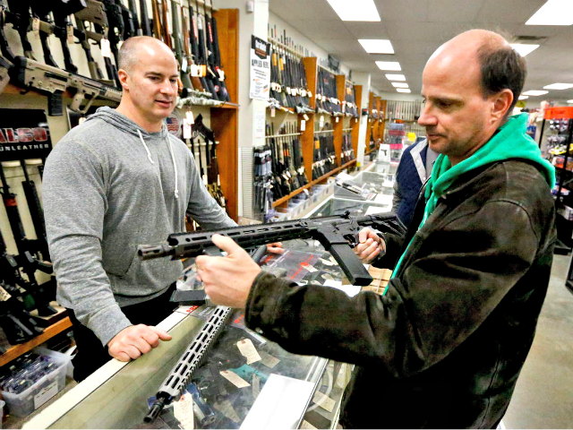 man in gun shop