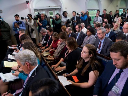 Members of the media attend the daily press briefing with White House Press Secretary Sarah Huckabee Sanders at the White House in Washington, DC, December 12, 2017. / AFP PHOTO / SAUL LOEB (Photo credit should read SAUL LOEB/AFP/Getty Images)