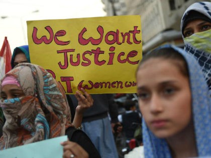 Supporters of Pakistan Awami Tehreek (PAT) take part in a protest after a child was raped