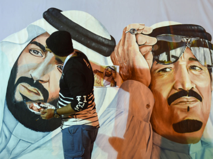 Saudi artists paint a mural portrait of King Salman bin Abdulaziz (R), and his son Crown Prince Mohammed bin Salman, during the 32nd Janadriyah Culture and Heritage Festival, held on the outskirts of the capital Riyadh on February 17, 2018. / AFP PHOTO / Fayez Nureldine (Photo credit should read …