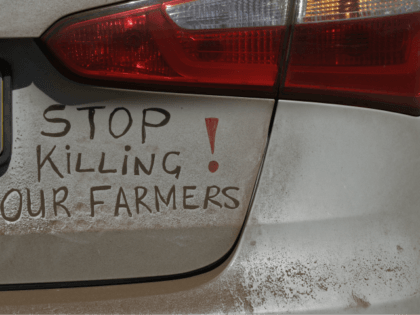 A bumper sign during a blockade of the freeway between Johannesburg and Vereeniging, in Midvaal, South Africa, in protest against the recent murder of farmers, Monday, Oct 30 2017. Traffic was bought to a standstill on highways leading from farming areas to Cape Town, Pretoria and Johannesburg, as white farmers …