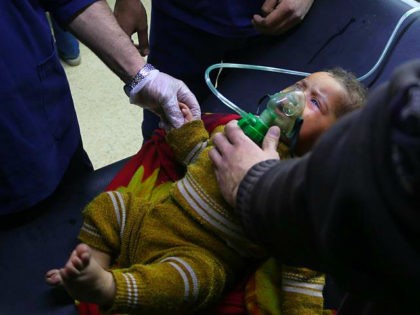 DAMASCUS, SYRIA - MARCH 6: A Syrian baby receives medical treatment at the field hospital after Assad Regime's alleged chlorine gas attack in Hamouriyah district of Eastern Ghouta in Damascus, Syria on March 6, 2018. (Photo by Mohammad Al Shami/Anadolu Agency/Getty Images)