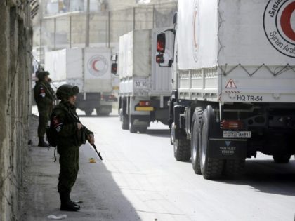 Aid convoy enters Syria enclave as regime presses offensive