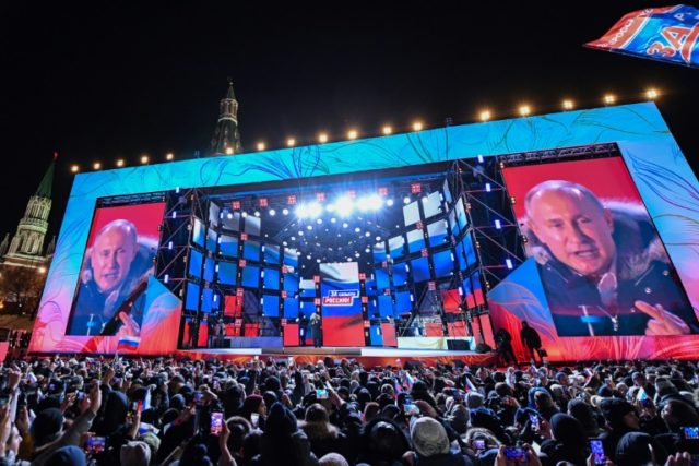 Putin storms to landslide election win