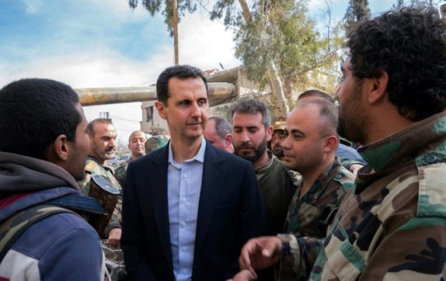 Syria's Assad visits troops in battle-scarred Ghouta