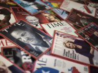 Time magazine copies are dispalyed on a table in Washgington on November 27, 2017. Time Inc. is selling for $2.8 billion to media conglomerate Meredith Corporation, which is backed by the billionaire Koch brothers, who are known for supporting conservative causes. Time, which also publishes its eponymous magazine, Fortune, and …