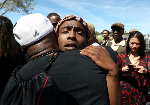 Grief and rage at funeral for police shooting victim in Sacramento
