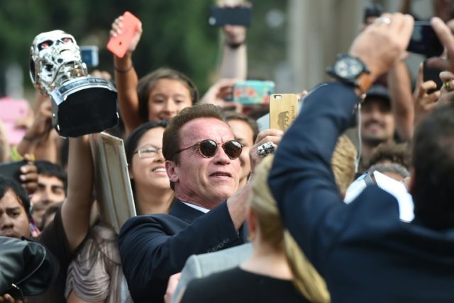 Schwarzenegger wakes from heart surgery declaring: 'I'm back!'