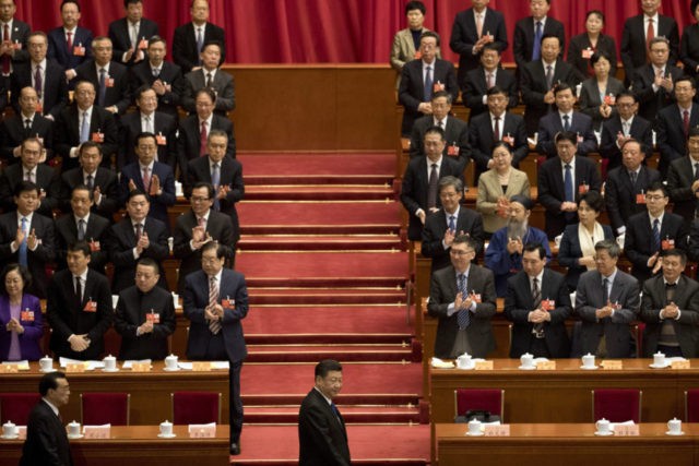 China Politics Power Grab Xi Jinping, Li Keqiang In this Saturday, March 3, 2018, photo, Chinese President Xi Jinping, center, arrives with Premier Li Keqiang, left, for the opening session of the Chinese People's Political Consultative Conference in Beijing's Great Hall of the People. Xi is poised to make a historic power grab as China's legislators gather from Monday and prepare to approve changes that will let him rule indefinitely and undo decades of efforts to prevent a return to crushing dictatorship. (AP Photo/Ng Han Guan) The Associated Press