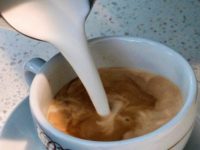 Coffee In this Sept. 22, 2017, file photo, a barista pours steamed milk in a coffee at a cafe in Los Angeles. Superior Court Judge Elihu Berle has ruled that California law requires coffee companies to carry an ominous cancer warning label because of a chemical produced in the roasting process. …