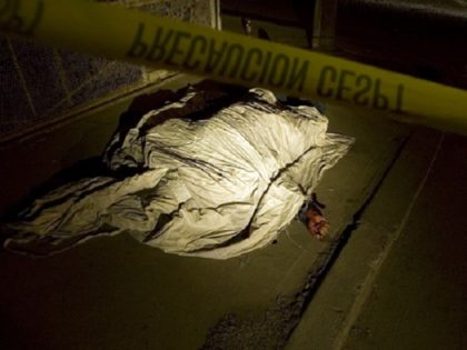 A man lies dead after a shootout in Tijuana, Mexico, Monday, Nov. 17, 2008. According to the police, nine men were shot dead Monday in several shootings throughout the city. Tijuana and Ciudad Juarez have both seen nearly daily killings as Mexico is swept up in a wave of drug-related …