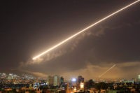 Syria US Damascus skies erupt with service to air missile fire as the U.S. launches an attack on Syria targeting different parts of the Syrian capital Damascus, Syria, early Saturday, April 14, 2018. Syria's capital has been rocked by loud explosions that lit up the sky with heavy smoke as U.S. President …