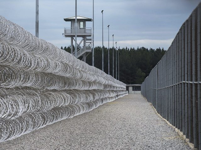 FILE - In this Feb. 9, 2016, file photo, razor wire protects a perimeter of the Lee Correc