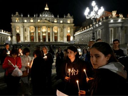 Members of the Italian association Comitato Articolo 26 take part in the Novena vigil prayer, praying for terminally ill British boy Alfie Evans, at the St Peter's square in Vatican, on April 26, 2018. (Photo by Alberto PIZZOLI / AFP) (Photo credit should read ALBERTO PIZZOLI/AFP/Getty Images)
