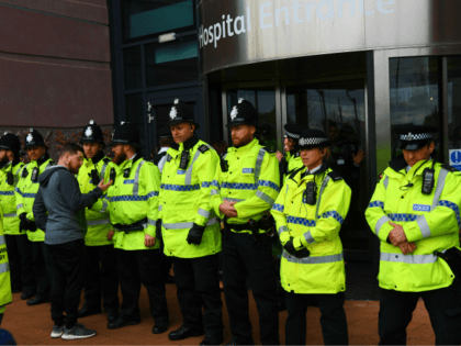 Police block the entrance to Alder Hey childrens hospital in Liverpool, northwest England as supporters of British toddler Alfie Evans try to storm the hospital following the announcement that the European court of human rights refused to intervene in his case on April 23, 2018. - Alfie Evans, who is …