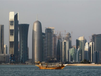 FILE - In this Thursday Jan. 6, 2011 file photo, a traditional dhow floats in the Corniche Bay of Doha, Qatar, with tall buildings of the financial district in the background. Qatar's government says it is forming a committee to pursue compensation for damages stemming from its isolation by four …