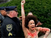 Cosbynakedattack1 A protester is detained as Bill Cosby arrives for his sexual assault trial at the Montgomery County Courthouse, Monday, April 9, 2018, in Norristown, Pa. (AP Photo/Corey Perrine)