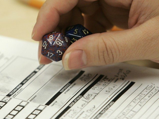 Dungeons & Dragons player holding dice