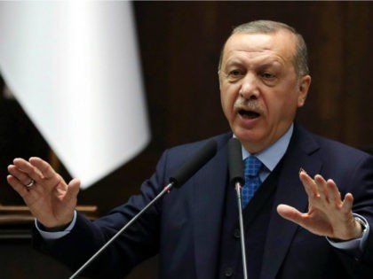 Turkish President and leader of the Justice and Development Party (AK Party) Recep Tayyip Erdogan gestures as he delivers a speech during the AK Party's parliamentary group meeting at the Grand National Assembly of Turkey (TBMM) in Ankara, on April 24, 2018. (Photo by ADEM ALTAN / AFP) (Photo credit …