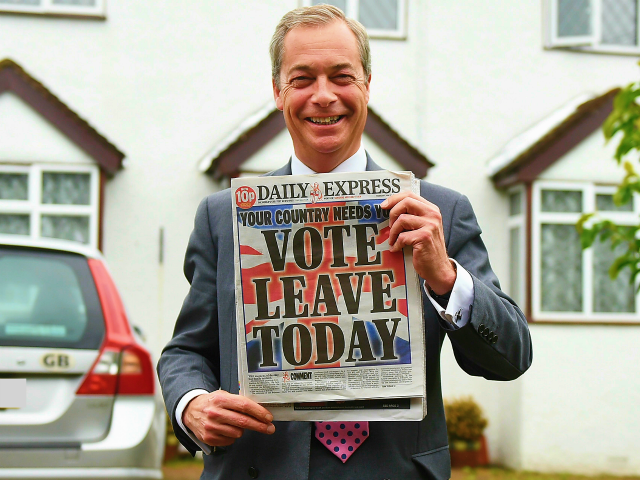 WESTERHAM, ENGLAND - JUNE 23: Nigel Farage, leader of UKIP and Vote Leave campaigner holds up the 'Daily Express' as he returns to his home after buying newspapers of the United Kingdom on June 23, 2016 in Westerham, England. The United Kingdom is going to the polls to decide whether …