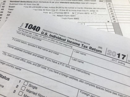 An IRS 1040 form, U.S. Individual Income Tax Return, is shown on Thursday, April 5, 2018, in New York. Leading automated financial advisers — often called “robo-advisers” — such as Wealthfront and Betterment tout daily tax-loss harvesting as a way to significantly increase your returns. But independent research suggests the …