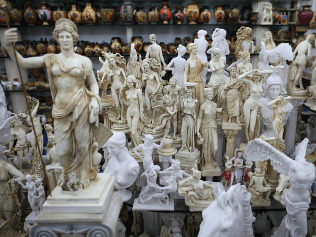 ATHENS, GREECE - FEBRUARY 19: Replica models of ancient Greek statues on display in a souv
