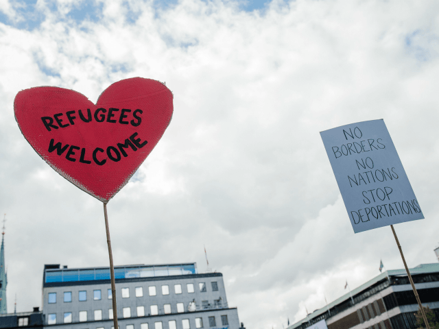 A sign reading 'refugees welcome' is pictured during a demonstration in solidarity with mi
