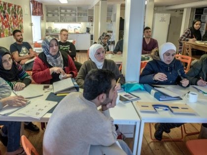 KLADESHOLMEN, SWEDEN - FEBRUARY 10: Refugees attend to Swedish language class at the temporary house for asylum seekers of the Vattendroppen school on February 10, 2016 in Kladesholmen, Sweden. Last year Sweden received 162,877 asylum applications, more than any European country proportionate to its population. According to the Swedish Migration …