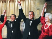 WASHINGTON, DC - NOVEMBER 5: US President Ronald Reagan (l) raises his arms in the air with presidential hopeful George Bush (2nd-r) after President Reagan announced endorsement for Bush as the next president of the United States in Washington DC, 05 November 1988. At left, First Lady Nancy Reagan, at …