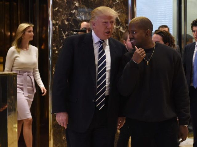 Singer Kanye West and President-elect Donald Trump leave the elevator after their meeting at Trump Tower on December 13, 2016 in New York. / AFP / TIMOTHY A. CLARY (Photo credit should read TIMOTHY A. CLARY/AFP/Getty Images)