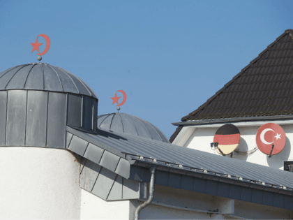 The roof of a mosque is pictured in Fuerthen, western Germany, on February 15, 2017. In connection with investigations against the Ditib mosque association on suspicion of espionage, German police searched the homes of four Turkish Muslim preachers on suspicion they spied for the government of President Recep Tayyip Erdogan, …