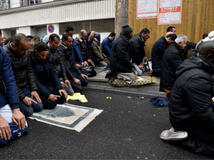 People pray in a street on November, 10, 2017, in Clichy, near Paris, while the city mayor demonstrate with others political leaders against muslim streets prayers. Muslim worshipers pray every friday on a small square in front of the Clichy's town hall to protest againt the closure of a Muslim …