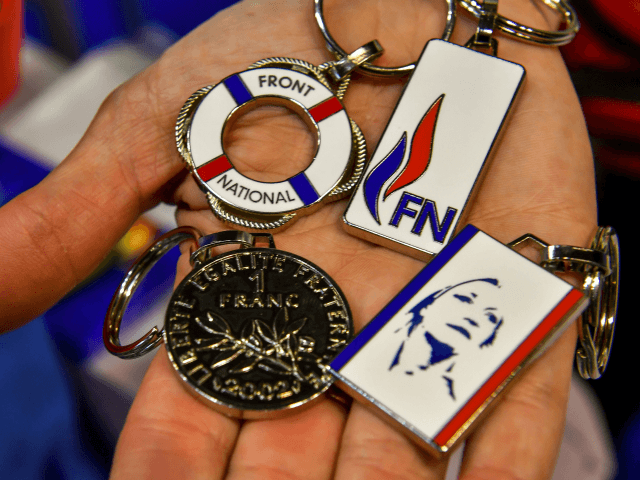 A person shows merchandising on sale at the French far-right party Front National's c