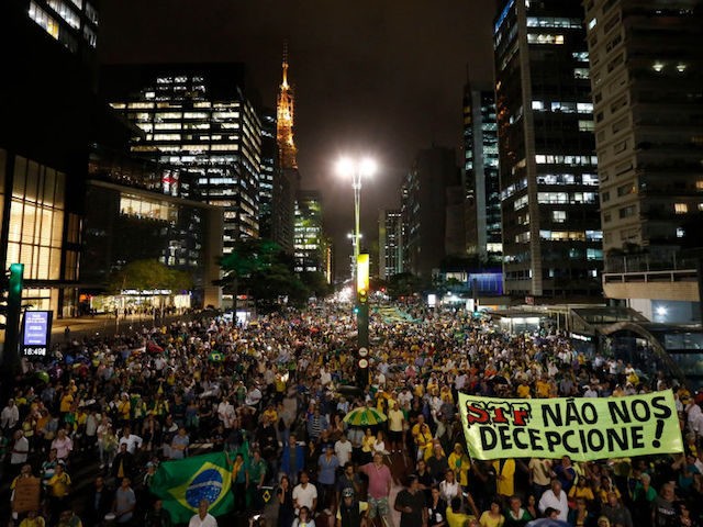 Demonstrators against former Brazilian President Luiz Inacio Lula da Silva hold a rally de