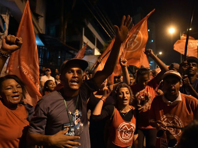 Supporters of Brazilian former president Luiz Inacio Lula da Silva gather in front of his