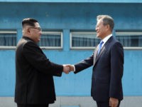 Inter-Korean Summit 2018 PANMUNJOM, SOUTH KOREA - APRIL 27: North Korean Leader Kim Jong Un (L) and South Korean President Moon Jae-in (R) shake hands over the military demarcation line upon meeting for the Inter-Korean Summit on April 27, 2018 in Panmunjom, South Korea. Kim and Moon meet at the border today for …