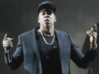 FILE - In this Nov. 4, 2016 file photo, Jay Z performs during a campaign rally for Democratic presidential candidate Hillary Clinton in Cleveland. Jay Z will become the first rapper ever inducted into the Songwriters Hall of Fame when he enters the prestigious organization in June. The Songwriters Hall …