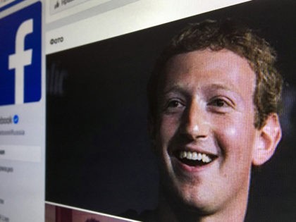 A picture taken in Moscow on March 22, 2018 shows an illustration picture of the Russian language version of Facebook about page featuring the face of founder and CEO Mark Zuckerberg. A public apology by Facebook chief Mark Zuckerberg, on March 22, 2018 failed to quell outrage over the hijacking …