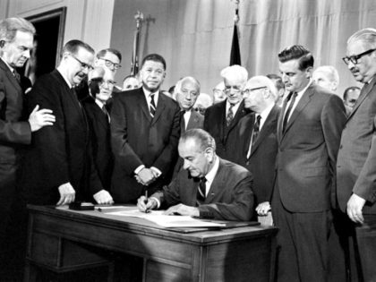 President Lyndon B. Johnson signs into law the Fair Housing Act of 1968