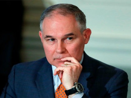 In this Feb. 12, 2018, file photo, Environmental Protection Agency Administrator Scott Pruitt attends a meeting at the White House in Washington. Pruitt flew in coach-class seats on at least two trips when taxpayers weren’t footing the bill, despite claims he needed to travel in first class at government expense …