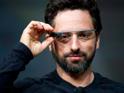 Sergey Brin, co-founder of Google Inc., wears Project Glass internet glasses while speakin